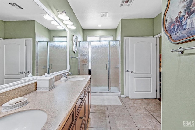 14030 Sandstone Peak Dr, Bakersfield, CA 93306 - bathroom featuring tile patterned floors, double vanity, and a shower stall