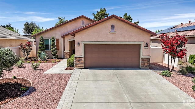 14030 Sandstone Peak Dr, Bakersfield, CA 93306 - mediterranean / spanish-style home with stone siding, driveway, an attached garage, and stucco siding