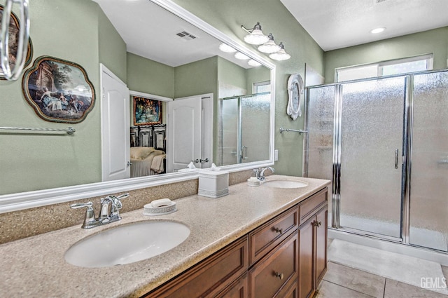14030 Sandstone Peak Dr, Bakersfield, CA 93306 - bathroom with double vanity, a stall shower, and tile patterned flooring