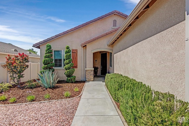14030 Sandstone Peak Dr, Bakersfield, CA 93306 - doorway to property featuring stucco siding