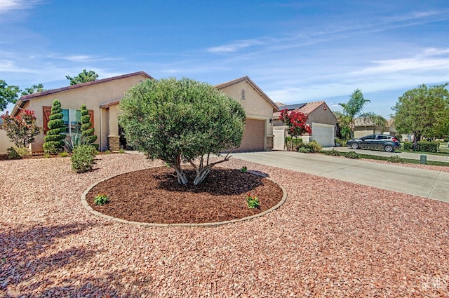 14030 Sandstone Peak Dr, Bakersfield, CA 93306 - view of front of house with curved driveway, stucco siding, and a garage