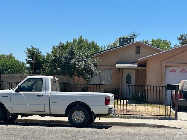 819 Stephen Ct, Wasco, CA 93280 - view of front of house with stucco siding and a garage