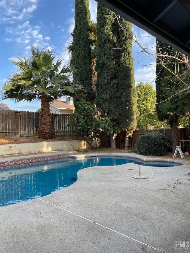 view of swimming pool with a patio, a fenced backyard, and a fenced in pool