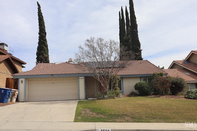 ranch-style house with concrete driveway, a front lawn, an attached garage, and a tile roof