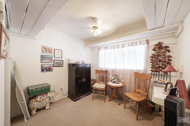 sitting room with carpet floors and ceiling fan