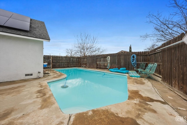 view of swimming pool with a fenced backyard, a fenced in pool, and a patio