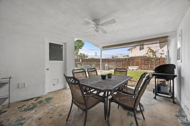 view of patio / terrace featuring ceiling fan, outdoor dining space, area for grilling, and fence