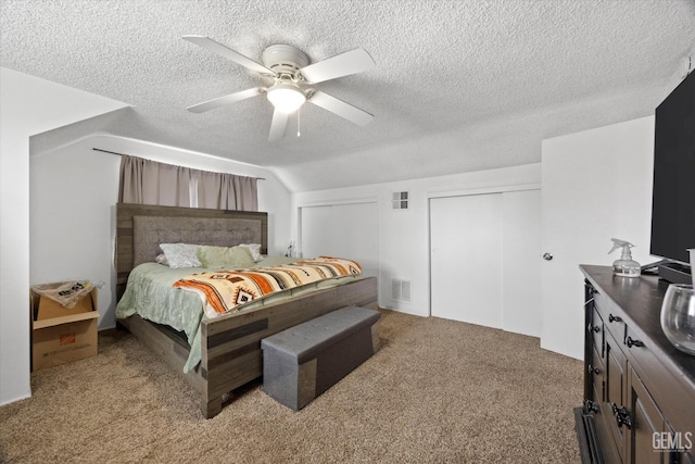 bedroom featuring light carpet, visible vents, ceiling fan, vaulted ceiling, and a textured ceiling