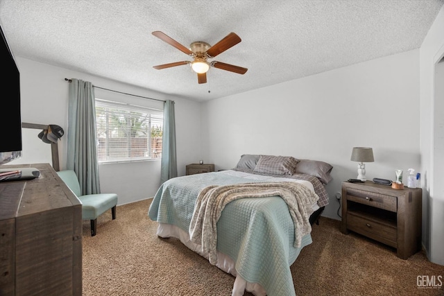 bedroom with a textured ceiling, ceiling fan, and carpet