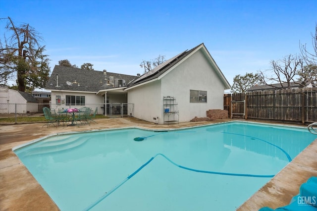 view of swimming pool with a patio area, a fenced backyard, and a fenced in pool