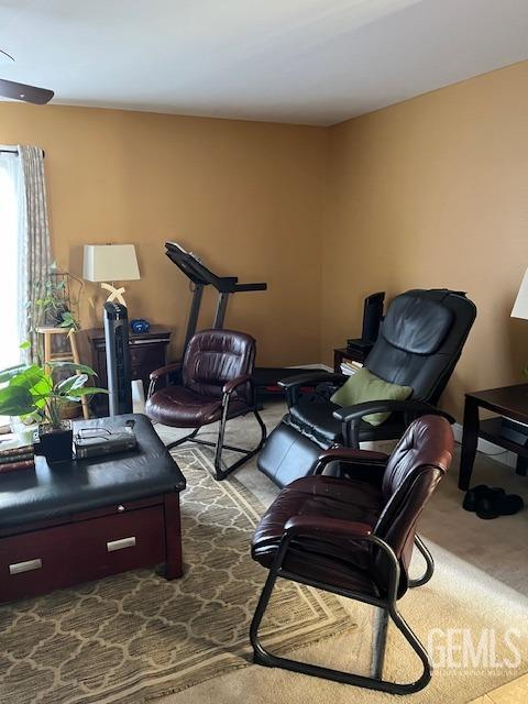 2626 E Cleo Ct Unit 29, Bakersfield, CA 93306 - living room with dark carpet