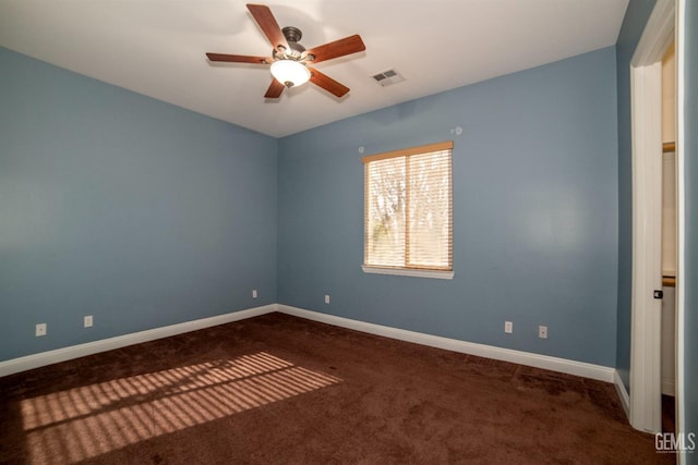 carpeted empty room featuring ceiling fan