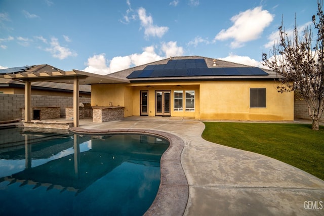 view of pool with a patio, area for grilling, and a yard