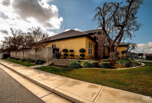 view of property exterior with a yard