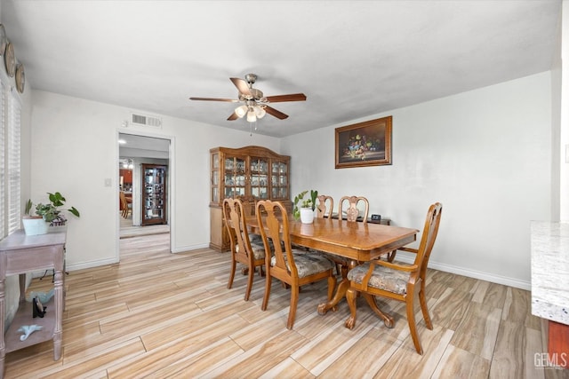 dining area with ceiling fan