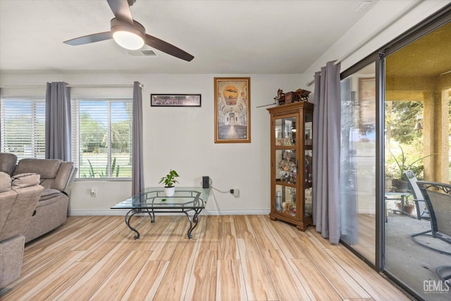 sitting room with light hardwood / wood-style flooring and ceiling fan