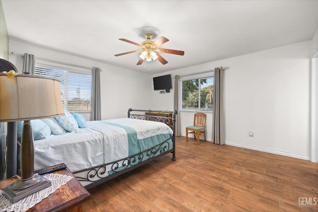 bedroom featuring ceiling fan and hardwood / wood-style flooring