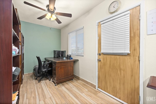 office space featuring light wood-type flooring and ceiling fan