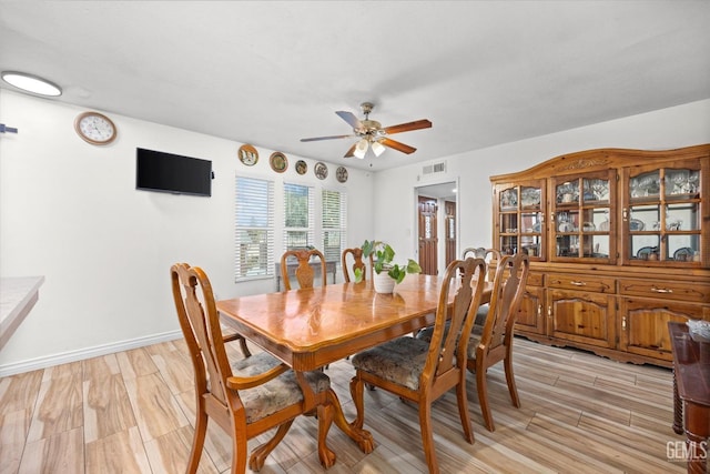 dining room featuring ceiling fan and light hardwood / wood-style floors