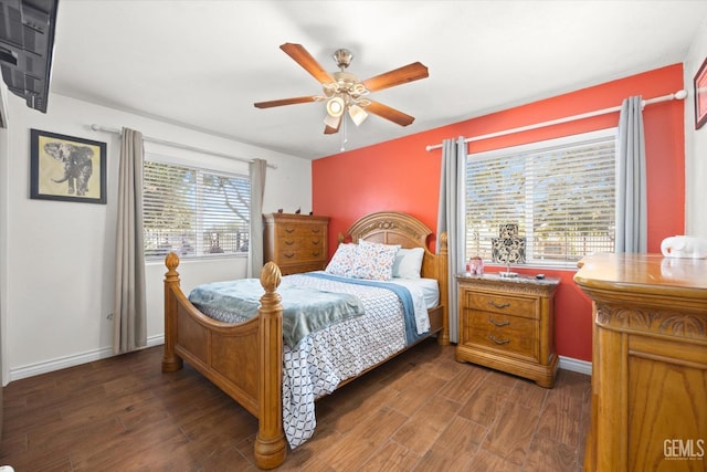 bedroom featuring ceiling fan and dark hardwood / wood-style flooring