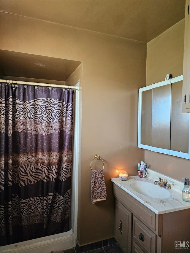 bathroom with tile patterned flooring, vanity, and a shower with shower curtain