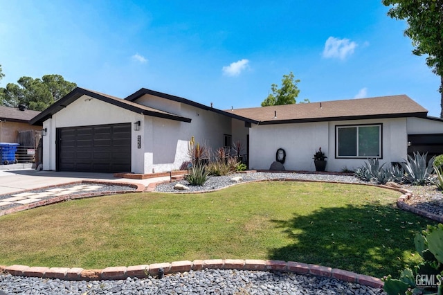 ranch-style house with a garage and a front yard