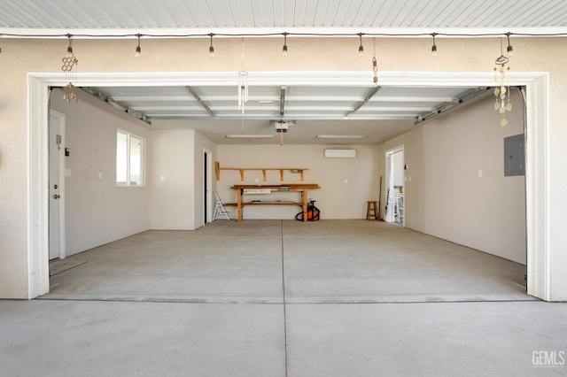 garage featuring electric panel and a garage door opener