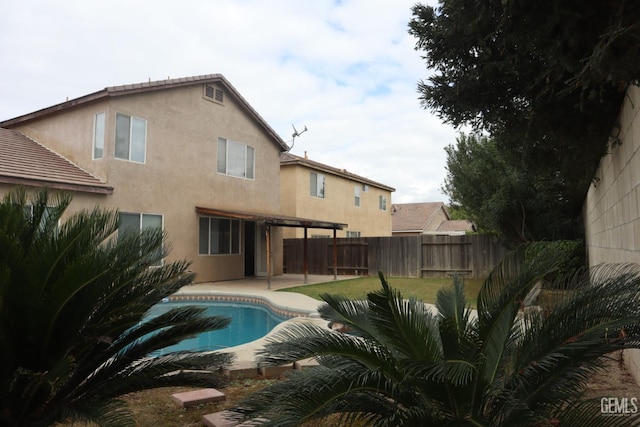 view of swimming pool with a fenced in pool, a patio, and a fenced backyard