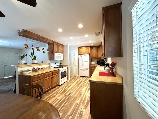 45796 Rocking K Dr, Cal Hot Springs, CA 93207 - kitchen featuring white appliances, recessed lighting, brown cabinets, a peninsula, and ceiling fan