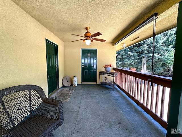 45796 Rocking K Dr, Cal Hot Springs, CA 93207 - view of exterior entry featuring ceiling fan, a balcony, and stucco siding