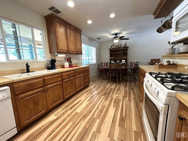 45796 Rocking K Dr, Cal Hot Springs, CA 93207 - kitchen featuring white appliances, a sink, brown cabinetry, a ceiling fan, and light countertops