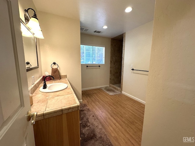45796 Rocking K Dr, Cal Hot Springs, CA 93207 - full bath featuring wood finished floors, vanity, a tile shower, baseboards, and recessed lighting