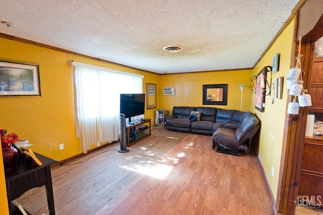 18695 Beech Ave, Shafter, CA 93263 - living area featuring light wood-style flooring, a textured ceiling, ornamental molding, and baseboards