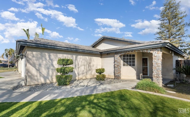 single story home featuring a garage, driveway, stone siding, stucco siding, and a front yard