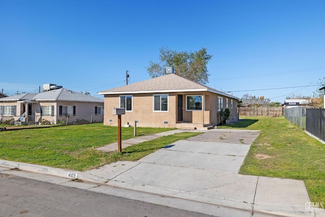 409 Jane St, Bakersfield, CA 93306 - bungalow-style house with concrete driveway, stucco siding, fence, and a front lawn