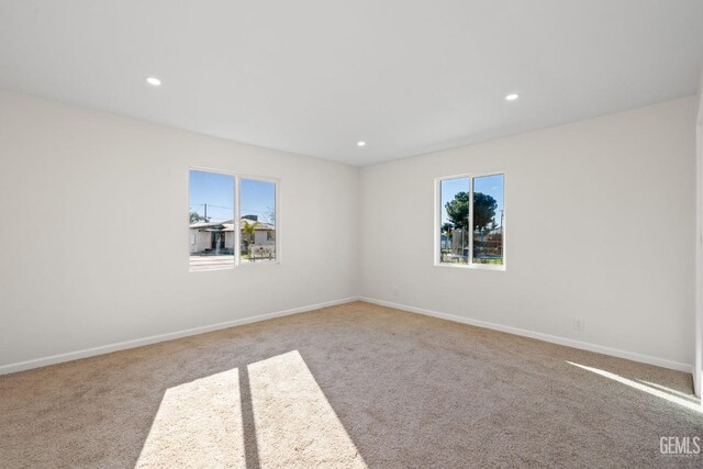 409 Jane St, Bakersfield, CA 93306 - carpeted spare room with baseboards and recessed lighting