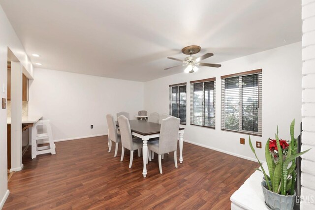 dining space featuring dark hardwood / wood-style floors and ceiling fan