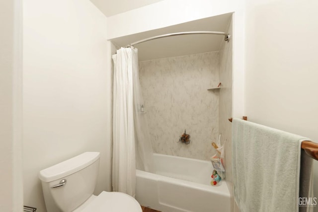 bathroom with shower / bath combo and toilet