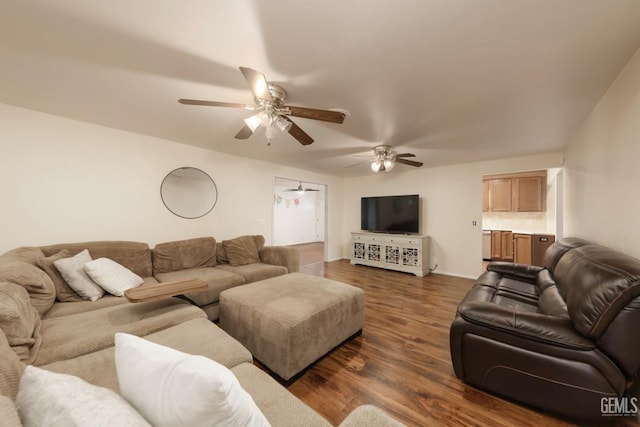 living room featuring ceiling fan and dark hardwood / wood-style floors