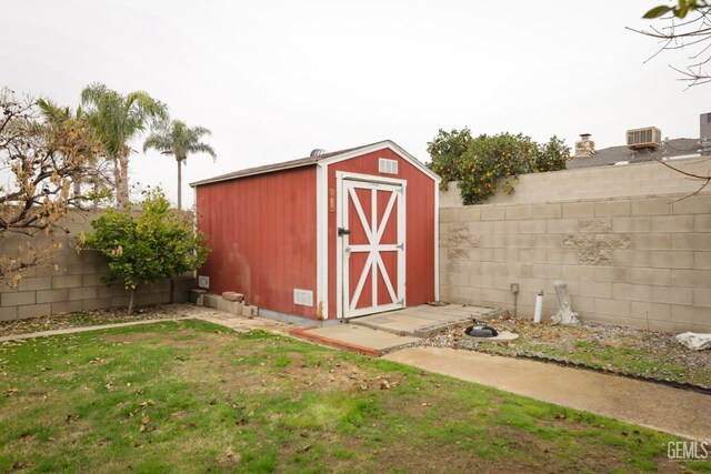 view of outbuilding with a lawn