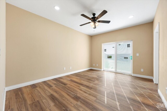 unfurnished room featuring hardwood / wood-style floors and ceiling fan