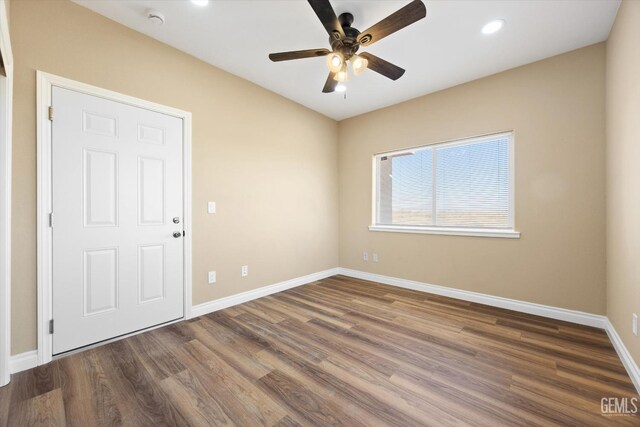 spare room featuring ceiling fan and wood-type flooring