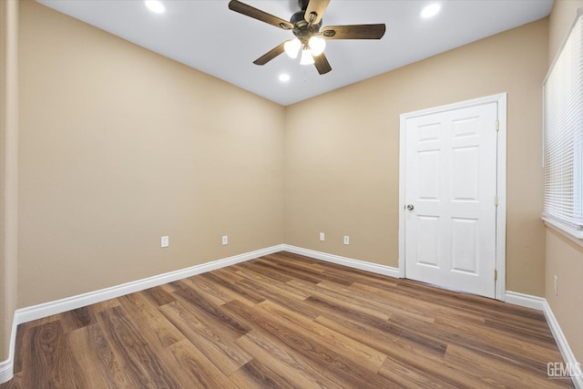 unfurnished room with ceiling fan and wood-type flooring