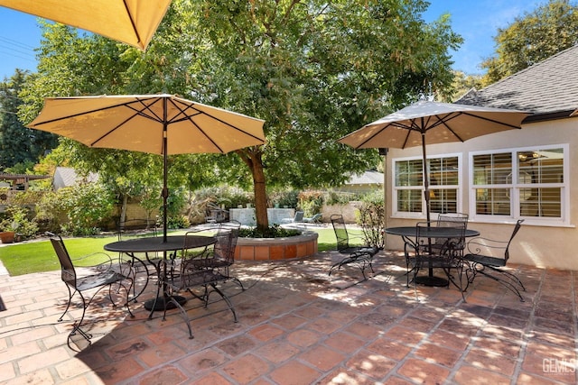 2615 22nd St, Bakersfield, CA 93301 - view of patio featuring fence and outdoor dining space
