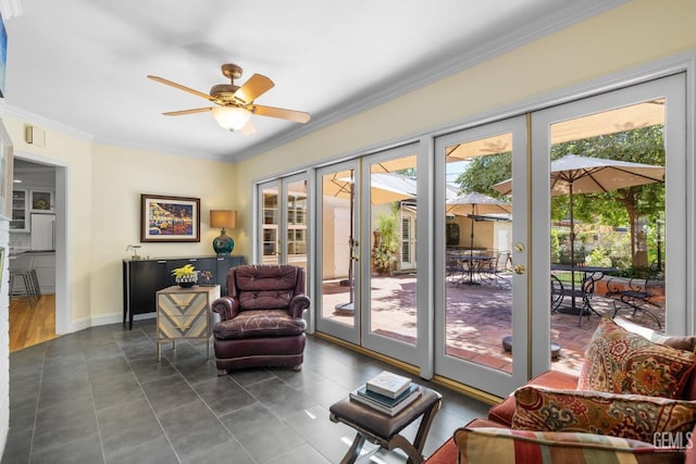 2615 22nd St, Bakersfield, CA 93301 - entryway with ornamental molding, a wealth of natural light, a ceiling fan, and dark tile patterned flooring