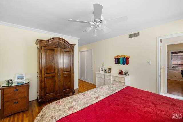 2615 22nd St, Bakersfield, CA 93301 - bedroom with a ceiling fan, wood finished floors, and visible vents