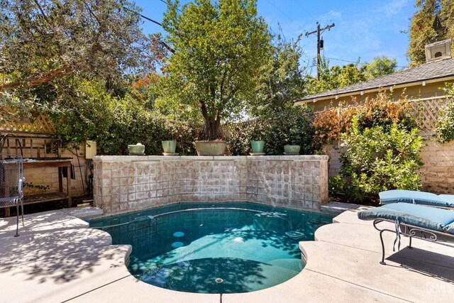 2615 22nd St, Bakersfield, CA 93301 - view of pool featuring a patio area, a fenced backyard, and a fenced in pool