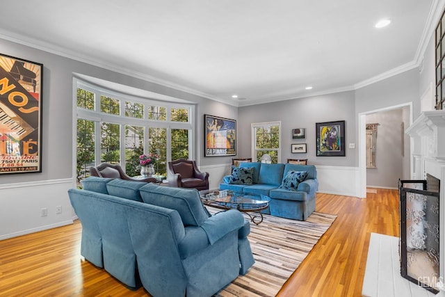 2615 22nd St, Bakersfield, CA 93301 - living room featuring a fireplace with flush hearth, a wealth of natural light, ornamental molding, and recessed lighting