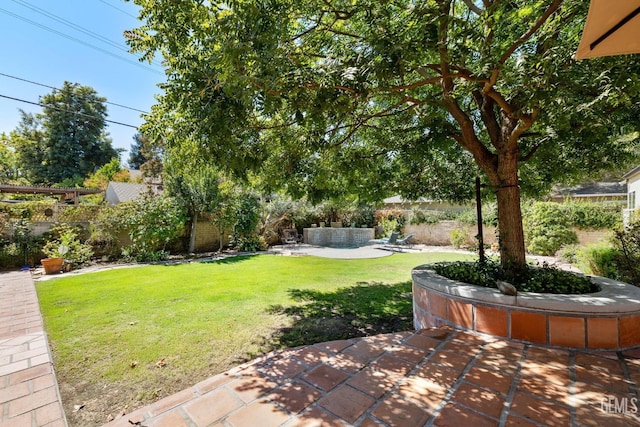 2615 22nd St, Bakersfield, CA 93301 - view of yard with a patio area and a fenced backyard