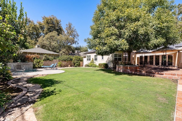 2615 22nd St, Bakersfield, CA 93301 - view of yard featuring a patio